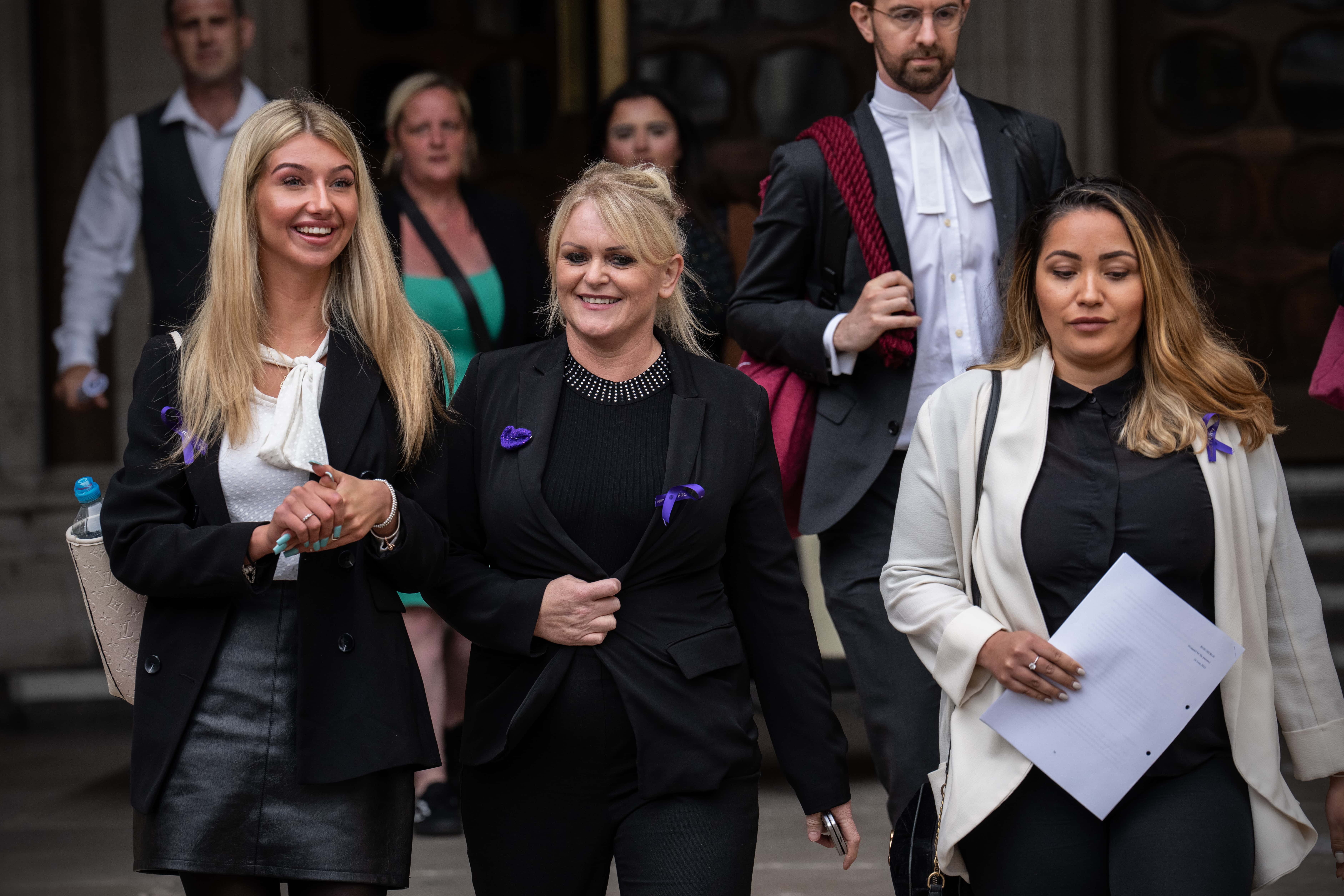 Hollie Dance (C), the mother of Archie Battersbee, leaves the Royal Courts of Justice after winning an appeal for his case to be heard again, on June 29, 2022 in London, England. The Court of Appeal heard a plea by the family of 12-year-old Archie Battersbee to overturn a previous court ruling that he is dead and his life support system should be removed. His parents Hollie Dance and Paul Battersbee have appealed the ruling, saying his heart is still beating and they want treatment to continue. (Photo by Carl Court/Getty Images)