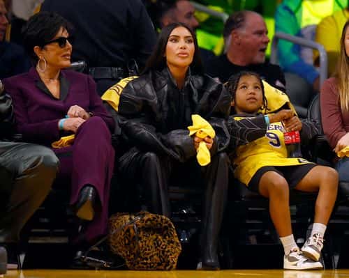 (L-R) Kris Jenner, Kim Kardashian and Saint West during play between the Memphis Grizzlies and the Los Angeles Lakers in the first half of Game Four of the Western Conference First Round Playoffs at Crypto.com Arena on April 24, 2023 in Los Angeles, California.  NOTE TO USER: User expressly acknowledges and agrees that, by downloading and/or using this photograph, user is consenting to the terms and conditions of the Getty Images License Agreement.