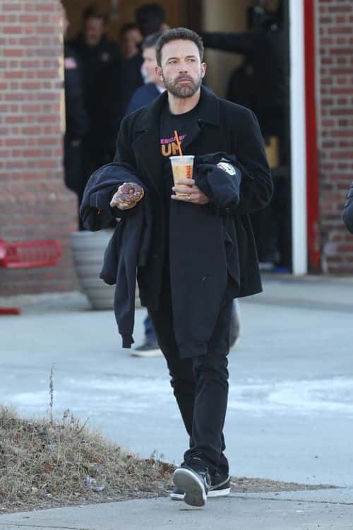 The 50-year-old was later seen enjoying a chocolate donut and coffee. (Backgrid)