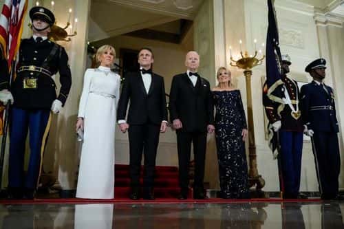 U.S. President Joe Biden, first lady Jill Biden, French President Emmanuel Macron and his wife Brigitte Macron pose for photos at the Grand Staircase of the White House ahead of the state dinner on December 1, 2022 in Washington, DC. President Biden is hosting Macron for the first official state visit of the Biden administration. (Photo by Drew Angerer/Getty Images)