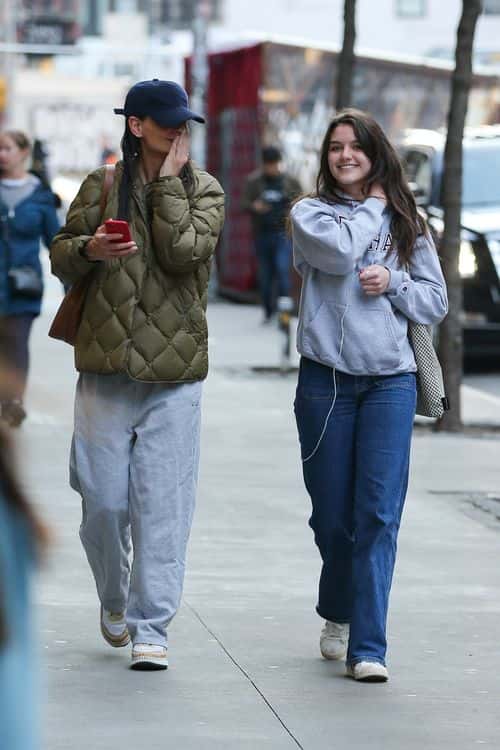 Suri was covered up in a gray hoodie for the New York–based Catholic university Fordham, which she wore with relaxed-fit jeans and red, white and blue sneakers (Backgrid)