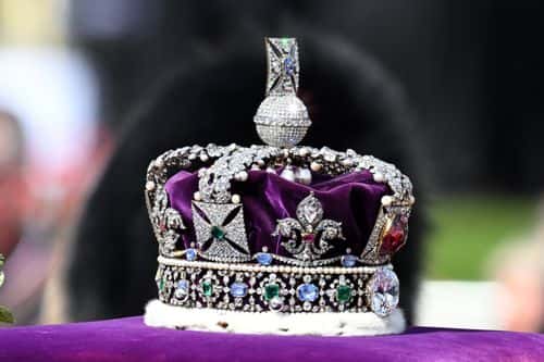 The Imperial State Crown is seen during the procession for the Lying-in State of Queen Elizabeth II on September 14, 2022 in London, England. Queen Elizabeth II's coffin is taken in procession on a Gun Carriage of The King's Troop Royal Horse Artillery from Buckingham Palace to Westminster Hall where she will lay in state until the early morning of her funeral. Queen Elizabeth II died at Balmoral Castle in Scotland on September 8, 2022, and is succeeded by her eldest son, King Charles III.