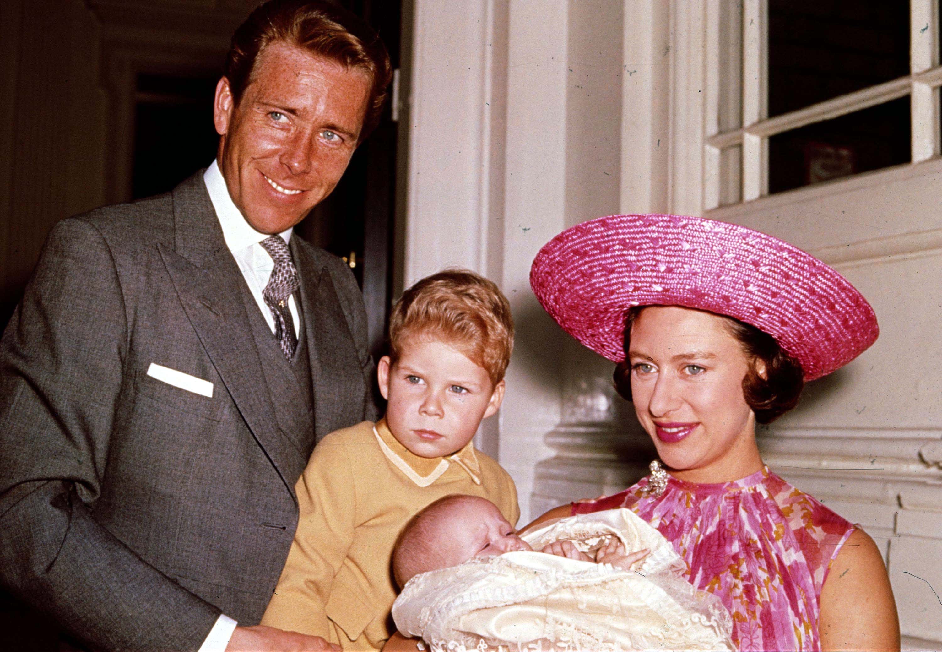 Britains Princess Margaret (R), Lord Snowdon (L), and Viscount Linley (2nd, L) pose for a photograph with Margarets infant daughter Lady Sarah Armstrong-Jones in 1964 at Kensington Palace in London. Princess Margaret died peacefully in her sleep at 1:30 a.m. EST at the King Edward VII Hospital in London February 9, 2002, announced Buckingham Palace. (Photo by Getty Images)