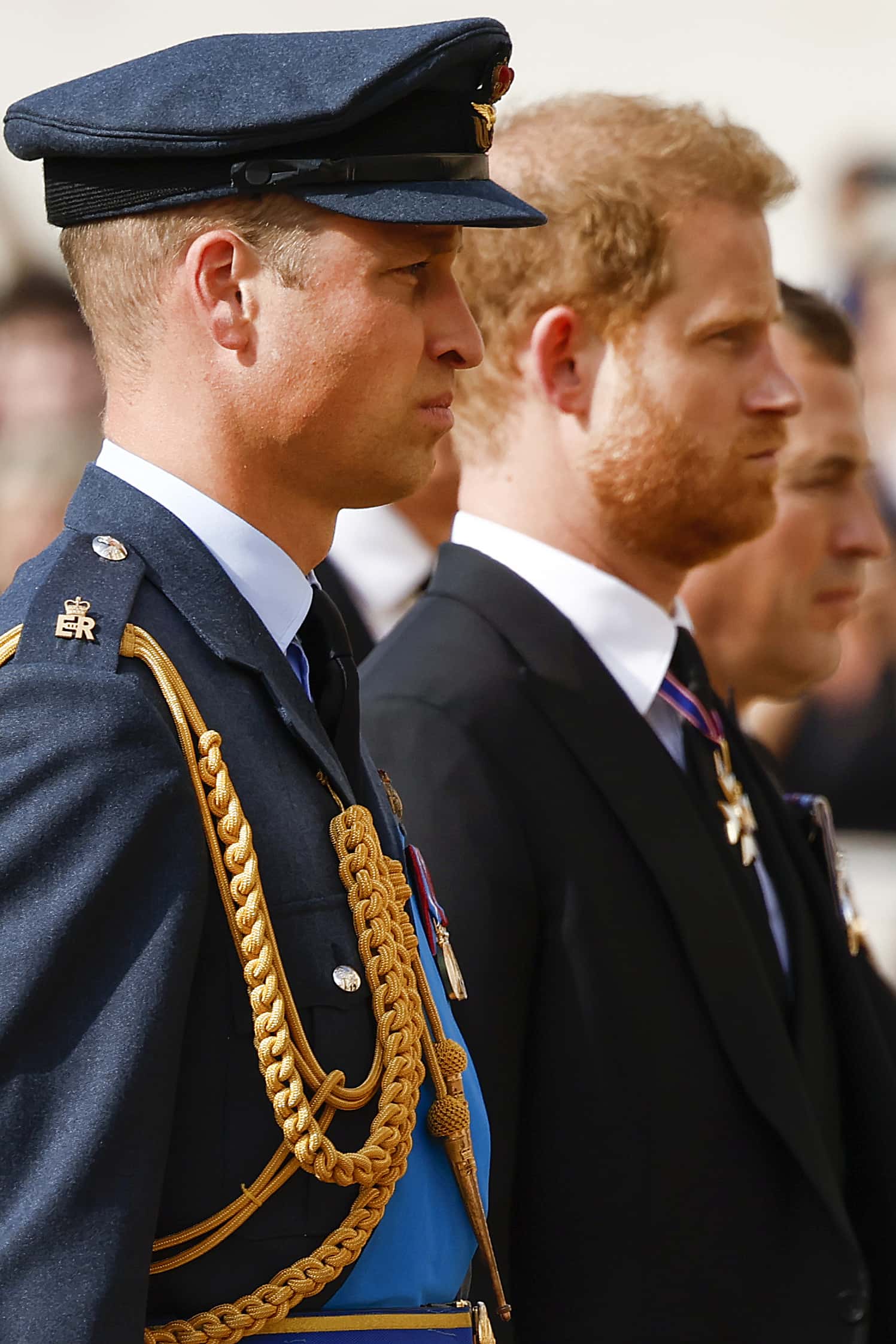 Prince William, Prince of Wales and Prince Harry, Duke of Sussex walk behind the coffin during the procession for the Lying-in State of Queen Elizabeth II on September 14, 2022 in London, England. Queen Elizabeth II's coffin is taken in procession on a Gun Carriage of The King's Troop Royal Horse Artillery from Buckingham Palace to Westminster Hall where she will lay in state until the early morning of her funeral. Queen Elizabeth II died at Balmoral Castle in Scotland on September 8, 2022, and is succeeded by her eldest son, King Charles III.