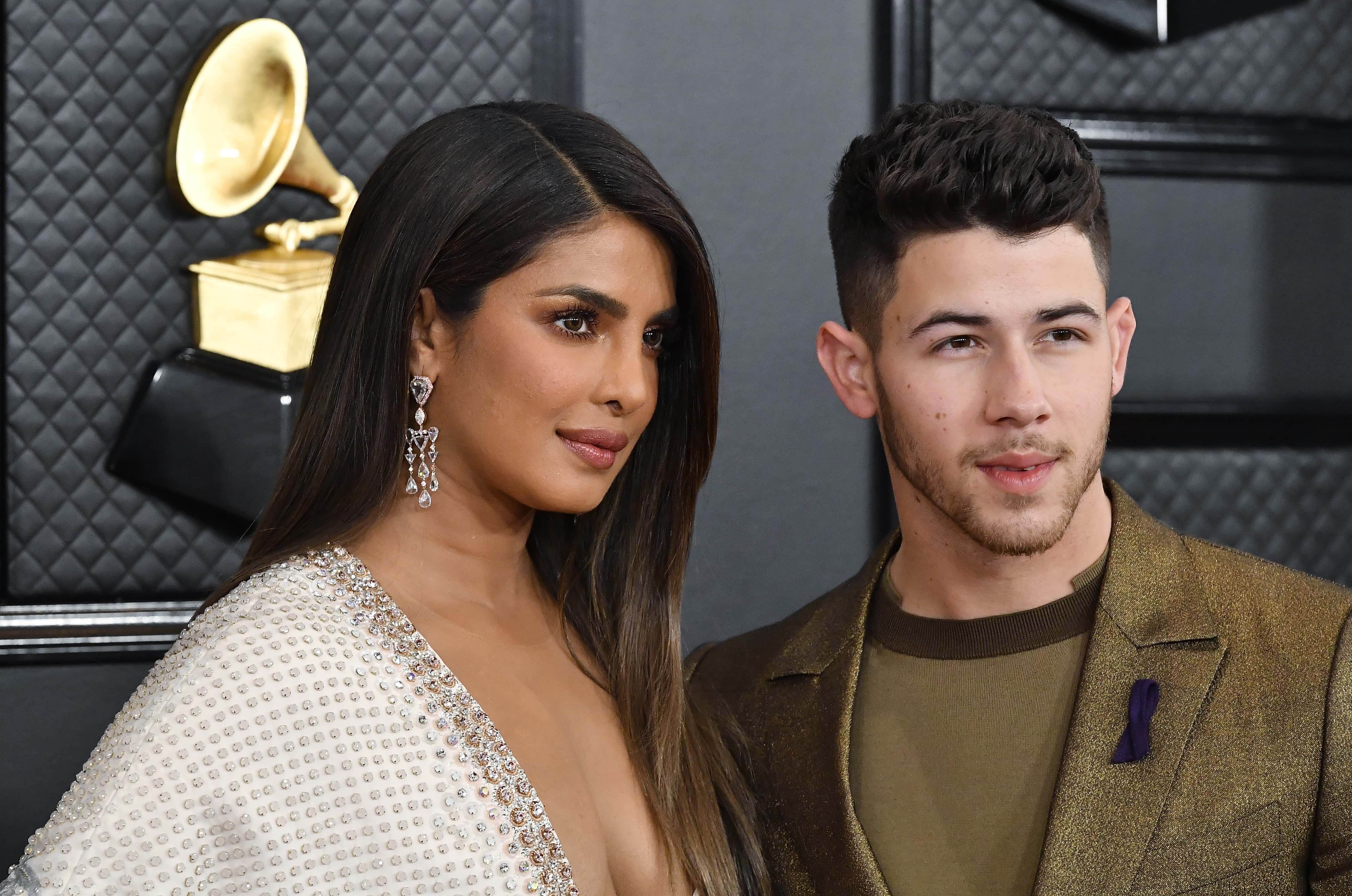 LOS ANGELES, CALIFORNIA - JANUARY 26: (L-R) Priyanka Chopra and Nick Jonas of music group Jonas Brot