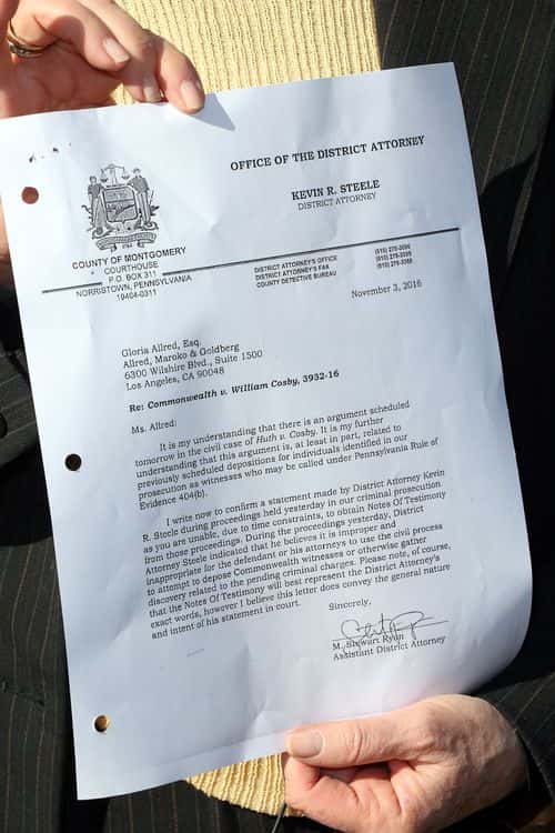 Attorney Gloria Allred displays a document during the press conference after the hearing and argument in the lawsuit on behalf of Judith Huth versus Bill Cosby at the Santa Monica Courthouse on November 4, 2016 in Santa Monica, California.  Huth is alleging that Cosby sexually assaulted her when she was a teen.