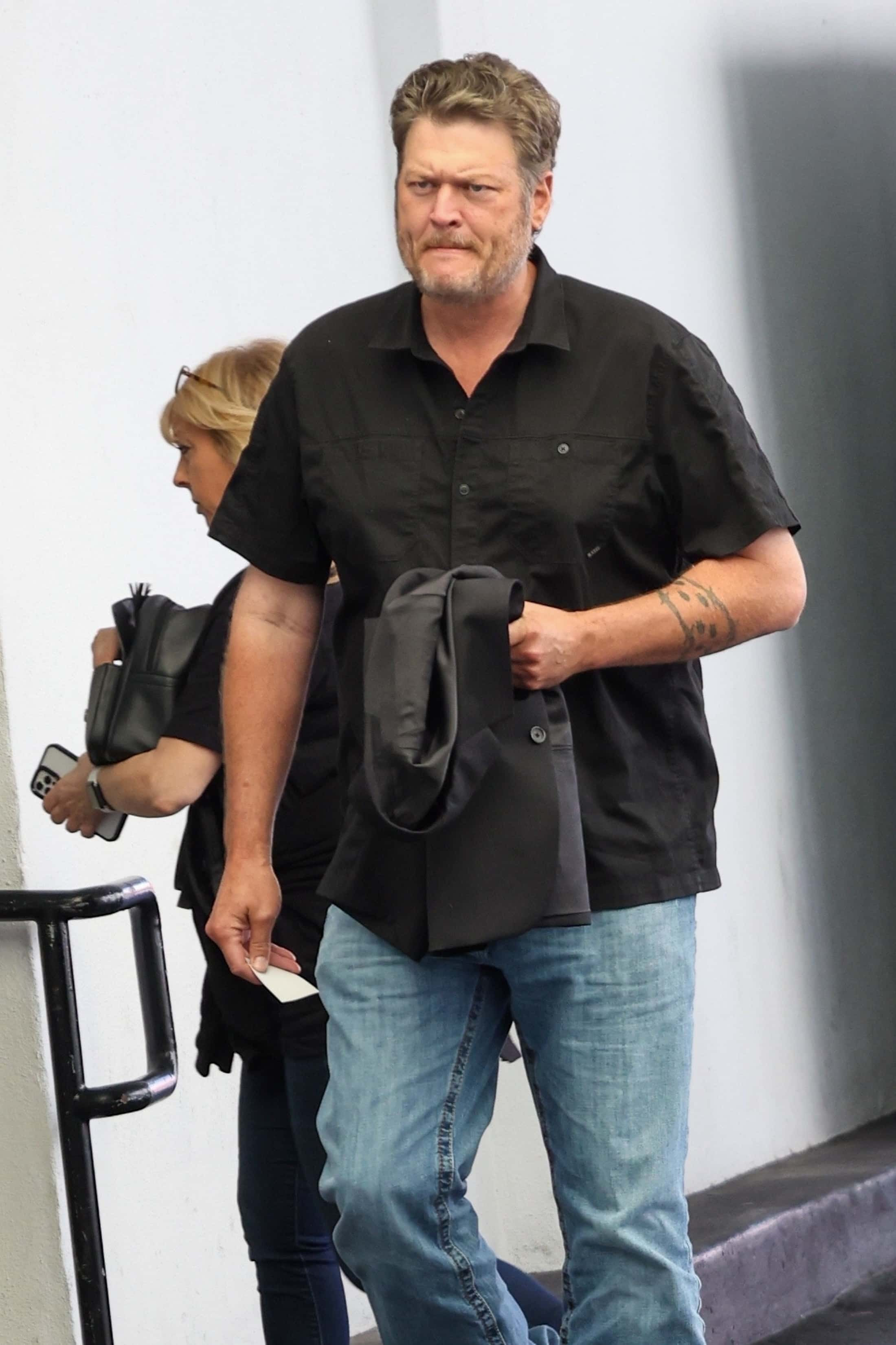 Shelton, who's poised to celebrate his 47th birthday on June 18, opted for his typical everyday ensemble consisting of blue jeans with a black button-down shirt (Backgrid)