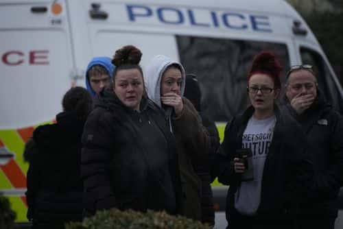 Mourners visit the scene after three young boys died when a number of children fell through ice on a lake, on December 12, 2022 at Babbs Mill Park in Solihull, England. Four children were taken to hospital in critical condition after falling through an icy lake here last night. The search continued for more potential victims, following reports more children were present on the ice at the time of the incident.