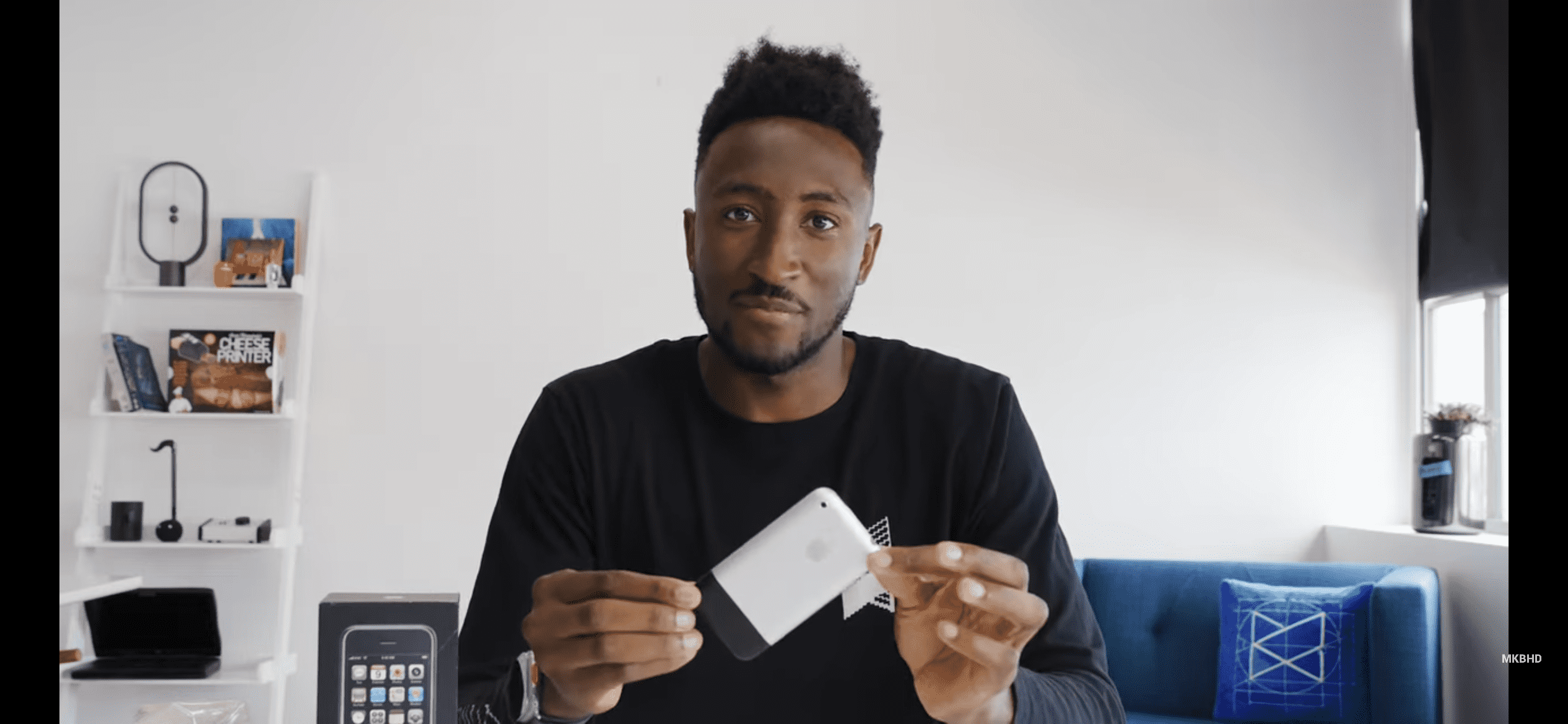 MKBHD with the 16-year-old iPhone 1.0 (MKBHD/YouTube)