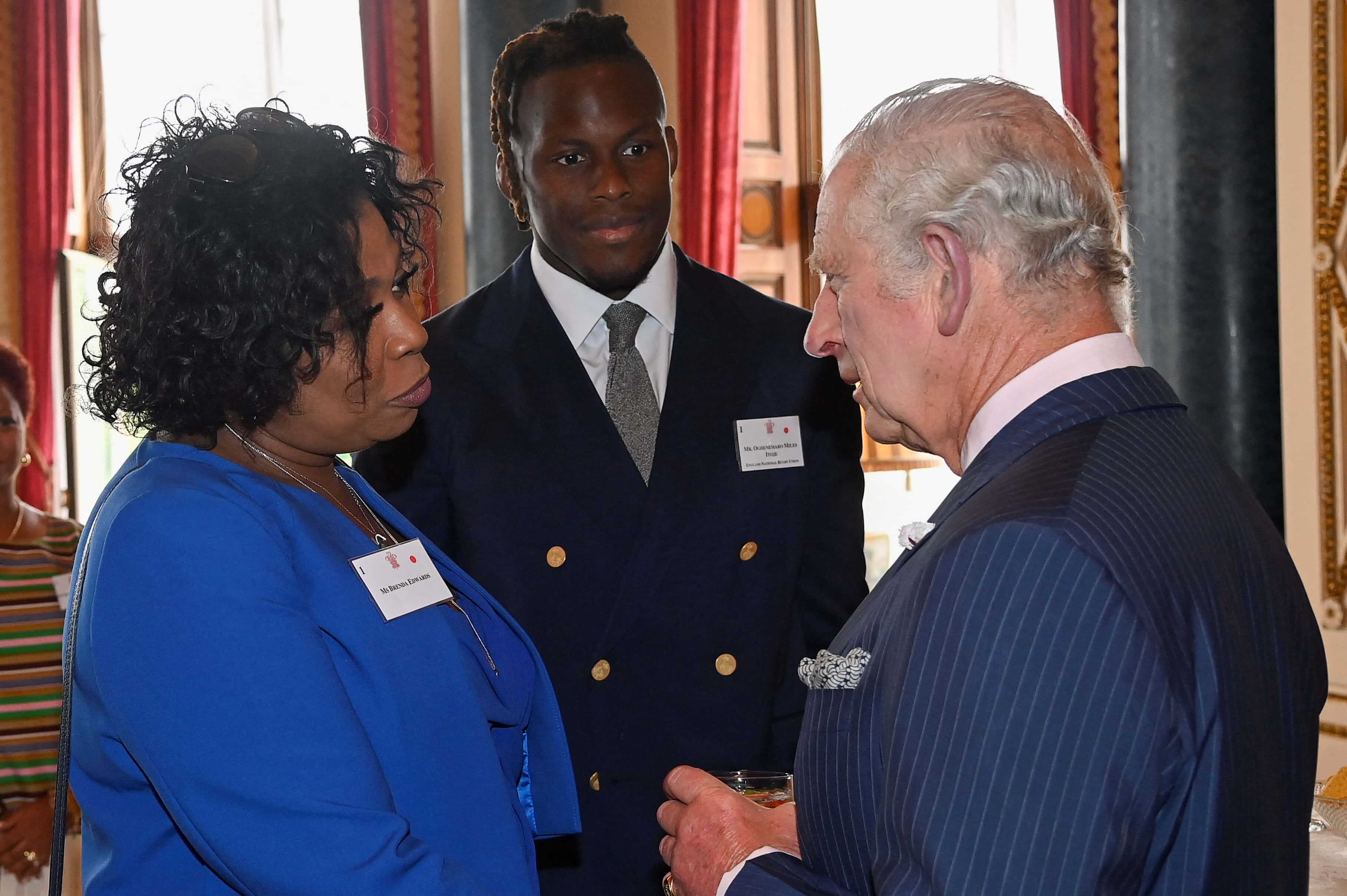 Prince Charles, Prince of Wales, meets singer and TV presenter Brenda Edwards and rugby player Oghenemaro Miles