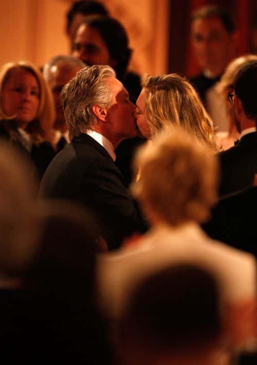 Actor Michael Douglas  (L) kisses actress Kathleen Turner during the AFI Lifetime Achievement Award: A Tribute to Michael Douglas held at Sony Pictures Studios on June 11, 2009 in Culver City, California.