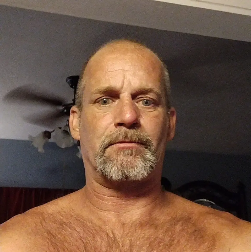 Dimick, a felon, also reportedly 'removed several firearms' from his home prior to law enforcement arriving, which police found at a 'neighboring property' (Marshall Dimick/Facebook)
