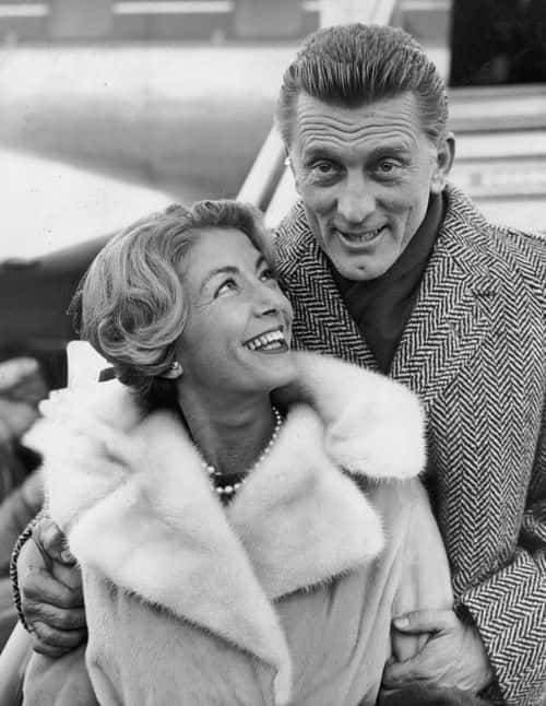 Kirk Douglas and his wife Anne Budyens arriving in London for the premiere of his new film, 'Spartacus'.