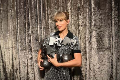 Taylor Swift is seen backstage with the Best Artist, Best Video, Best Pop and Best Longform Video Awards during the Best MTV Europe Music Awards 2022 held at PSD Bank Dome on November 13, 2022 in Duesseldorf, Germany.