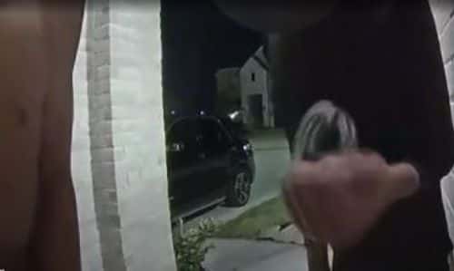The teen holding the handcuff (KHOU)