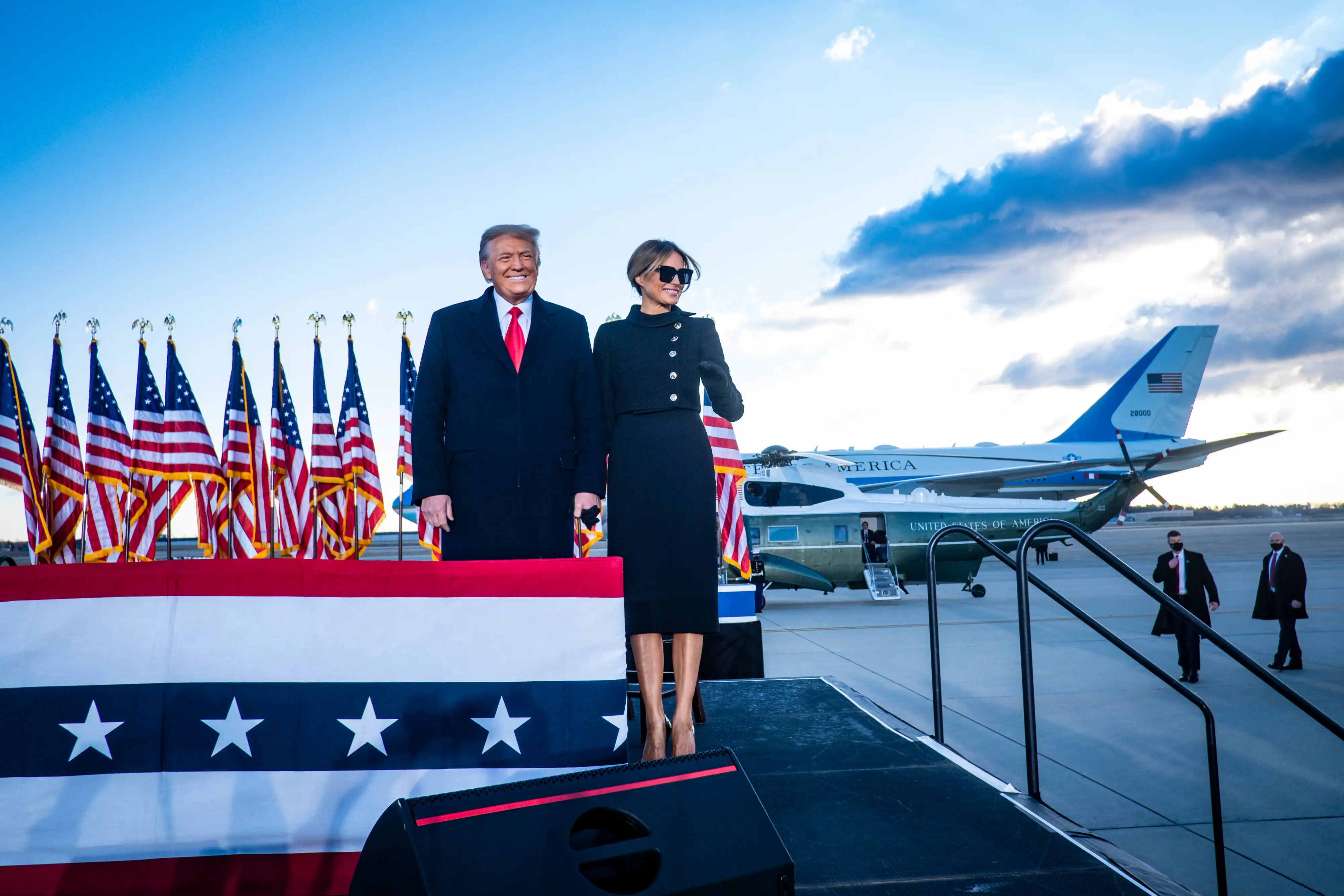 President Donald Trump and First Lady Melania Trump acknowledge supporters at Joint Base Andrews before boarding Air Force One for his last time as President on January 20, 2021 in Joint Base Andrews, Maryland. Trump, the first president in more than 150 years to refuse to attend his successor's inauguration, is expected to spend the final minutes of his presidency at his Mar-a-Lago estate in Florida. (Photo by Pete Marovich - Pool/Getty Images)