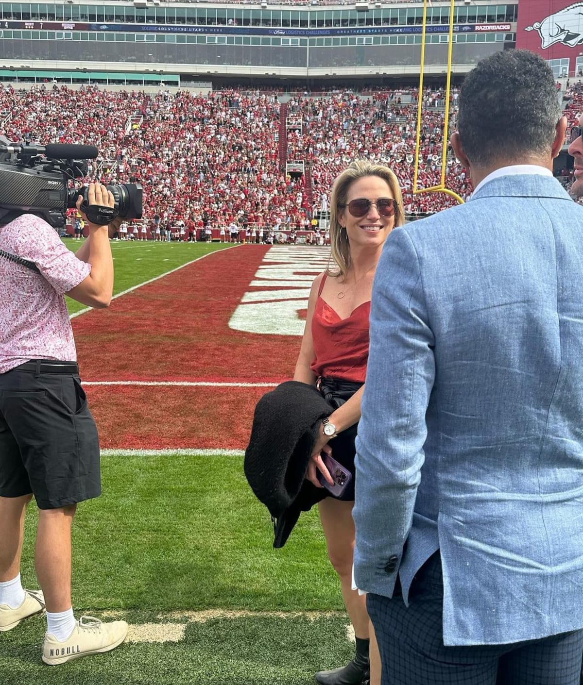TJ Holmes and Amy Robach were captured on the sidelines of the game (@officialTJholmes/Instagram)