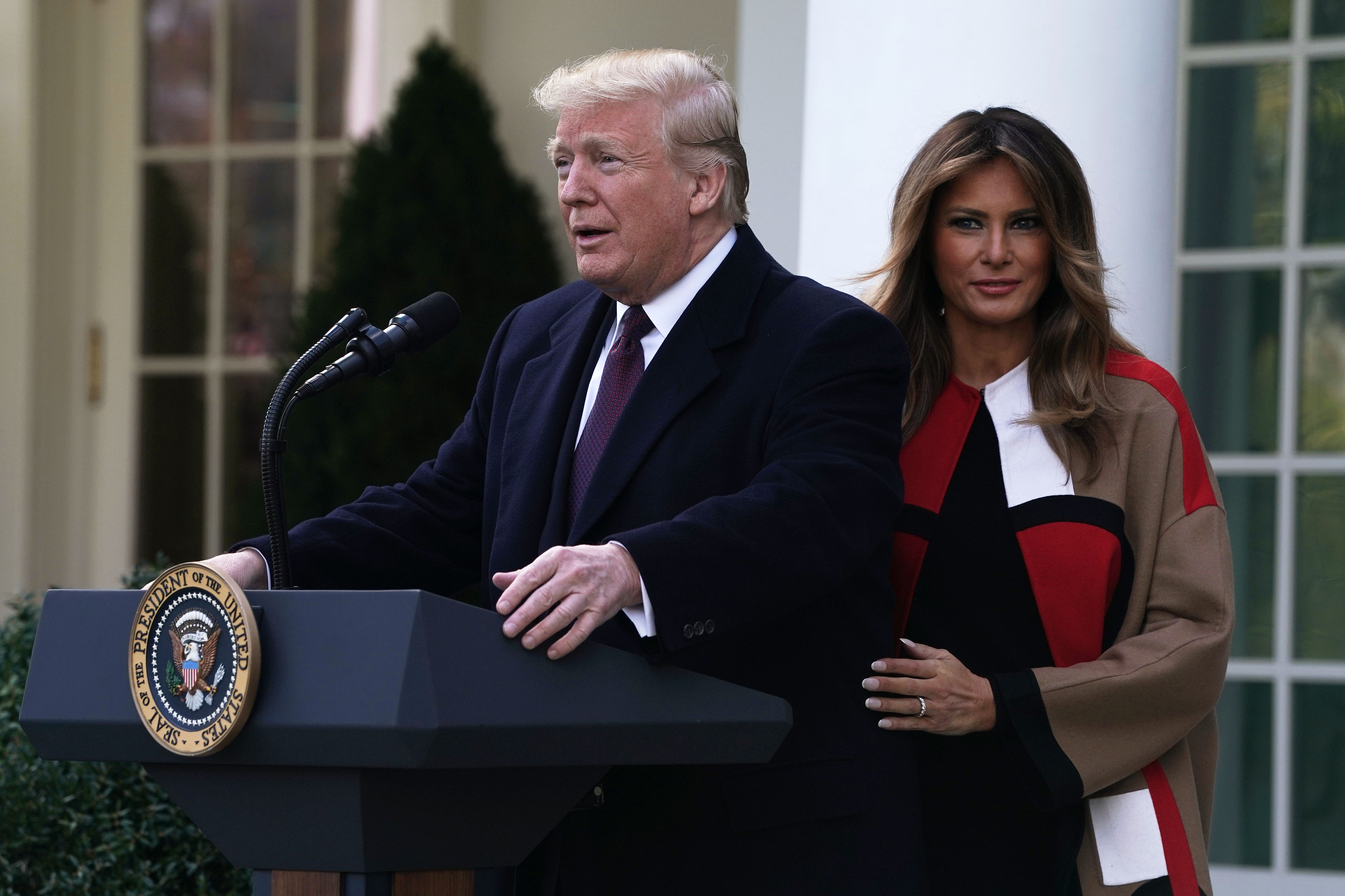 U.S. President Donald Trump (L) and first lady Melania Trump (R) participate in a turkey pardoning event at the Rose Garden of the White House November 20, 2018 in Washington, DC. The two turkeys, Peas and Carrots, will spend the rest of their lives in a farm after the annual Thanksgiving presidential tradition today.