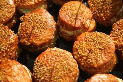 Smoked salmon patties covered with sesame seeds lie on display at a stand at the International Green Week agricultural trade fair (Internationale Gruene Woche) on January 16, 2015 in Berlin, Germany. The International Green Week is the world's largest agricultural trade fair and is open to the public from January 16-25.