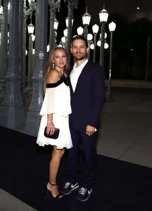 Jewelry designer Jennifer Meyer (L) and actor Tobey Maguire attend the 2014 LACMA Art + Film Gala honoring Barbara Kruger and Quentin Tarantino presented by Gucci at LACMA on November 1, 2014 in Los Angeles, California. (Photo by Rich Polk/Getty Images for LACMA)
