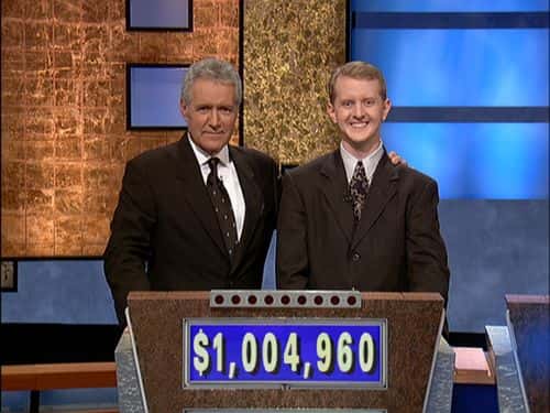 Jeopardy host Alex Trebek, (L) poses contestant Ken Jennings after his earnings from his record breaking streak on the gameshow surpassed 1 million dollars July 14, 2004 in Culver City, California.