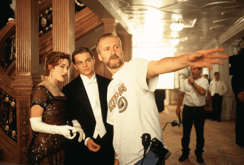 James Cameron on the set with Kate Winslet and Leonardo DiCaprio (20th Century Studios)