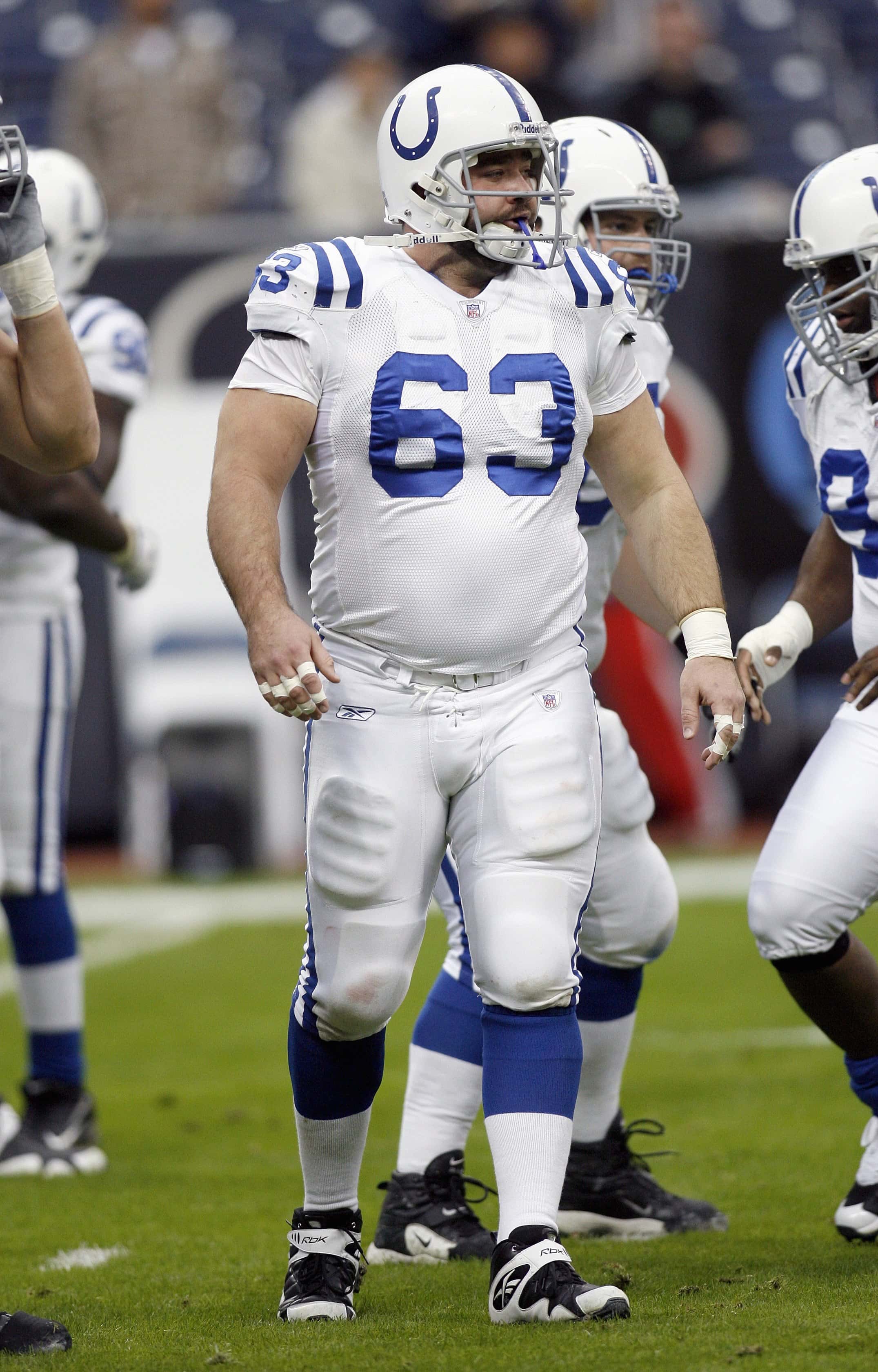 Center Jeff Saturday #63 of the Indianapolis Colts walks on the field during the game against the Houston Texans on December 24, 2006 at Reliant Stadium in Houston, Texas. The Texans defeated the Colts 27-24.
