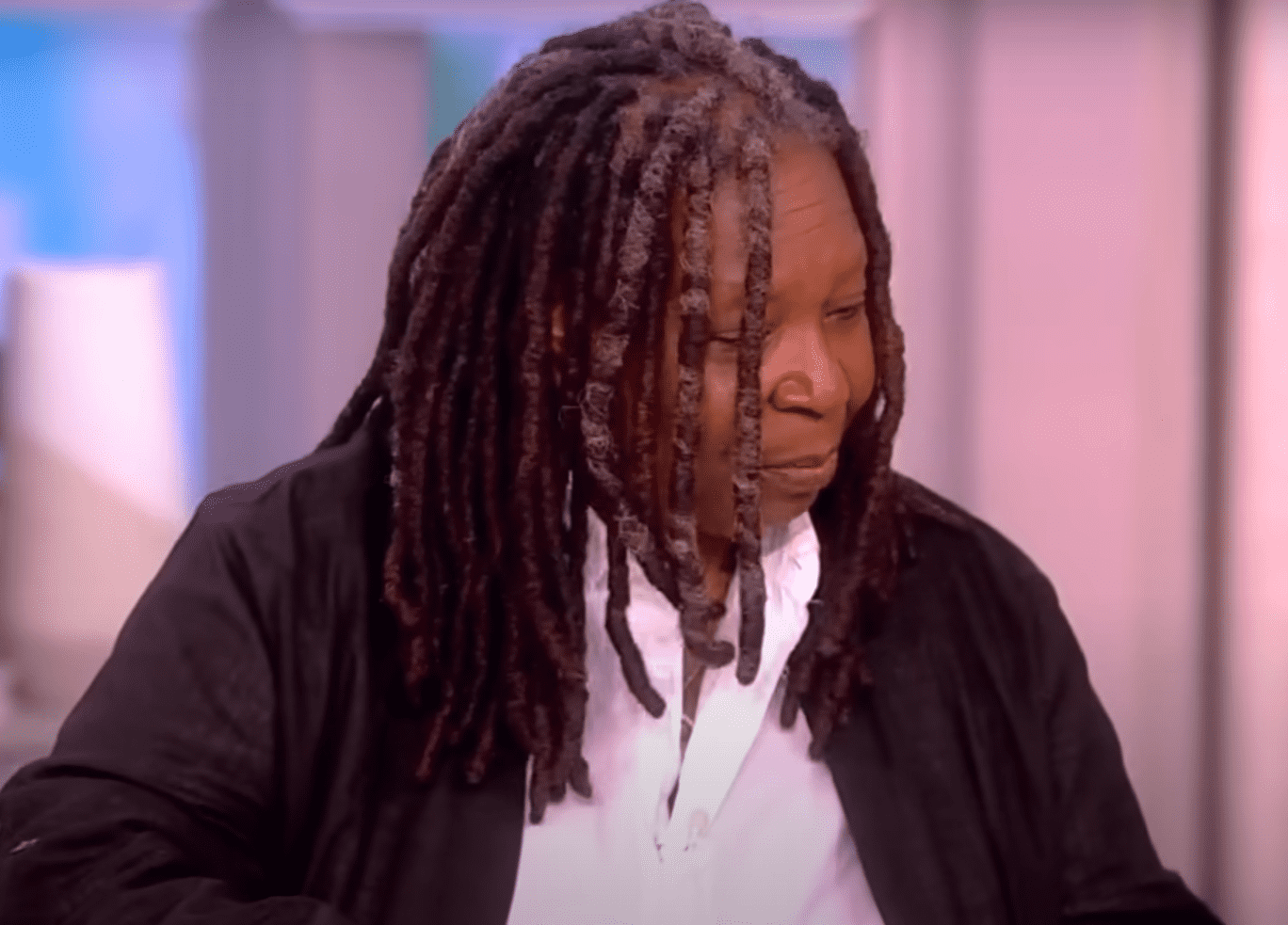 Whoopi Goldberg looks confused as she sorts through the cue cards (YouTube/TheView)
