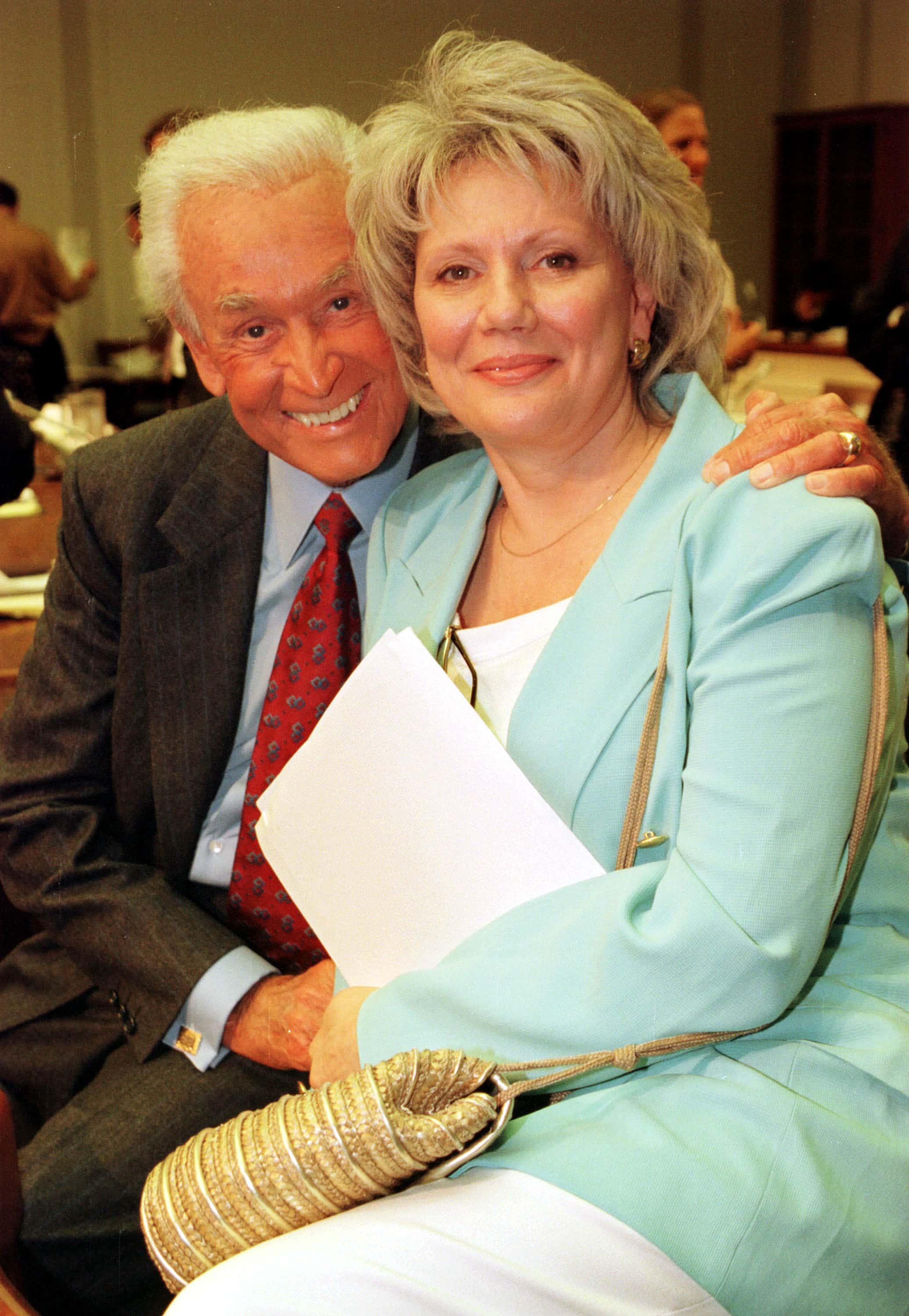 370849 07: Game show host Bob Barker, left, poses for photographers with Nancy Burnet, Director of U