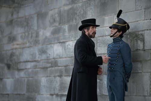 Christian Bale as Augustus Landor, Harry Melling as Cadet Edgar Allen Poe in 'The Pale Blue Eye' (Netflix)