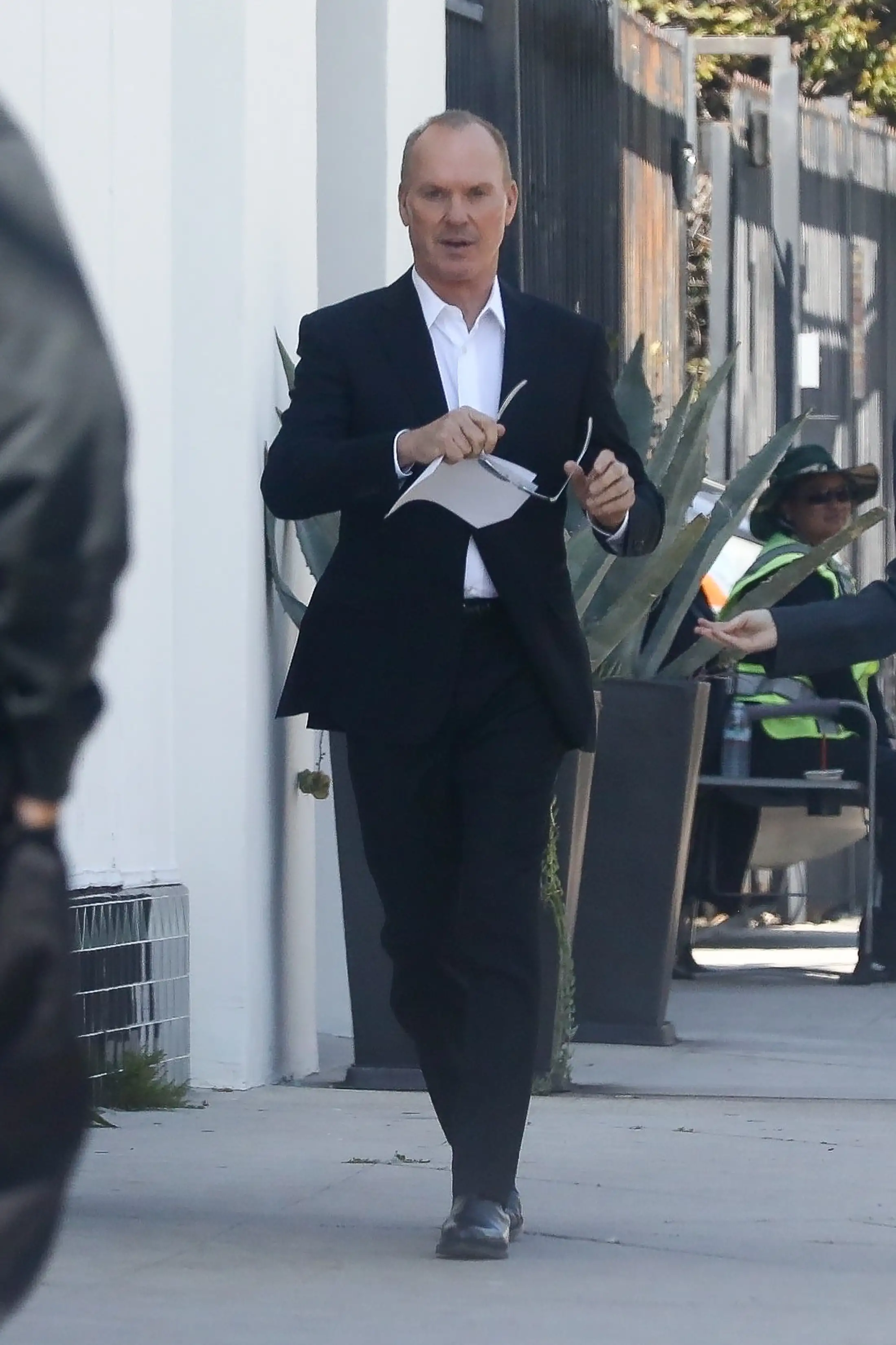 The 71-year-old actor looked dapper in a black suit over a crisp white shirt and leather shoes (backgrid)