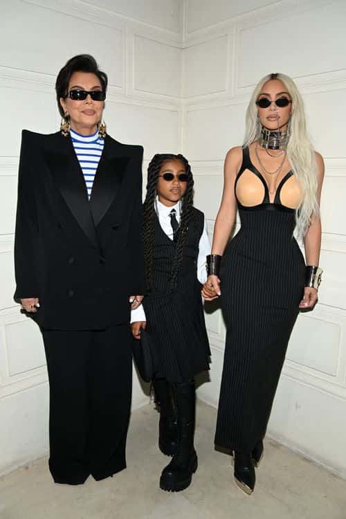 (EDITORIAL USE ONLY - For Non-Editorial use please seek approval from Fashion House) (L-R) Kris Jenner, North West and Kim Kardashian attend the Jean-Paul Gaultier Haute Couture Fall Winter 2022 2023 show as part of Paris Fashion Week  on July 06, 2022 in Paris, France.