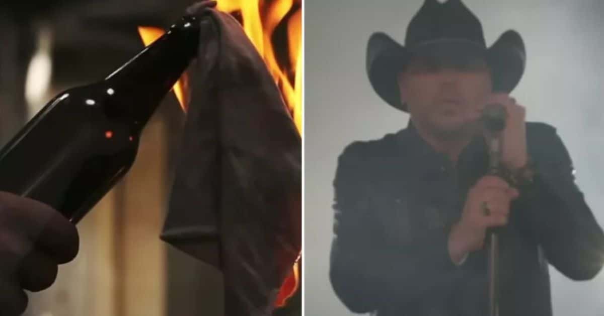 The projected picture has been changed in the updated video to a brief close-up of a guy lighting a Molotov cocktail (Jason Aldean/YouTube)