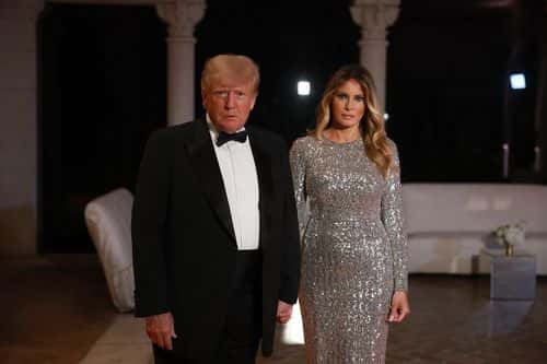 Former U.S. President Donald Trump and former first lady Melania Trump arrive for a New Years event at his Mar-a-Lago home on December 31, 2022 in Palm Beach, Florida. Trump continues to run for a second term as the President of the United States.