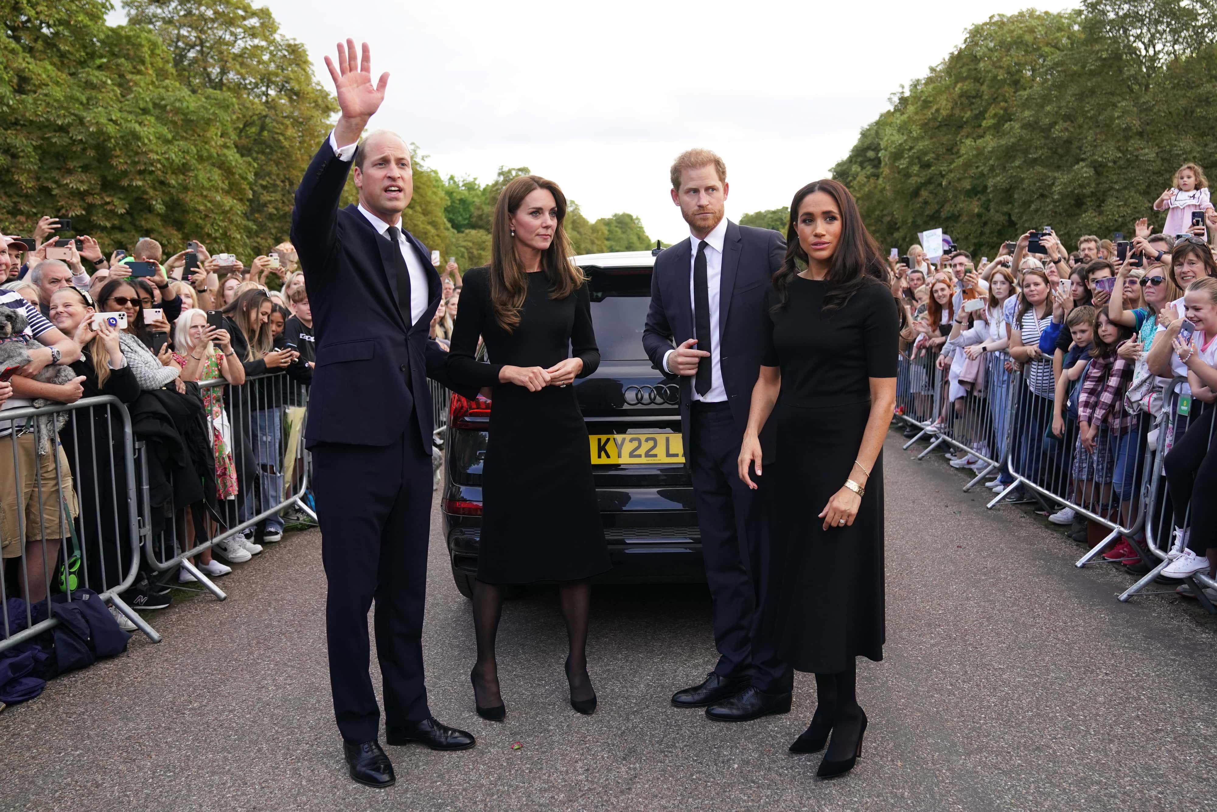 Catherine, Princess of Wales, Prince William, Prince of Wales, Prince Harry, Duke of Sussex, and Meghan, Duchess of Sussex meet members of the public on the long Walk at Windsor Castle on September 10, 2022 in Windsor, England. Crowds have gathered and tributes left at the gates of Windsor Castle to Queen Elizabeth II, who died at Balmoral Castle on 8 September, 2022.