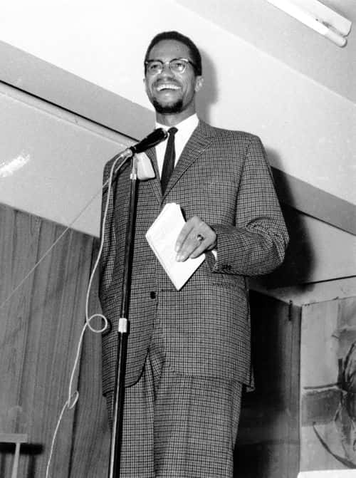 African-American activist and Muslim minister Malcolm X (1925 - 1965) addresses a meeting, UK, 22nd November 1964. (Photo by Express/Hulton Archive/Getty Images)