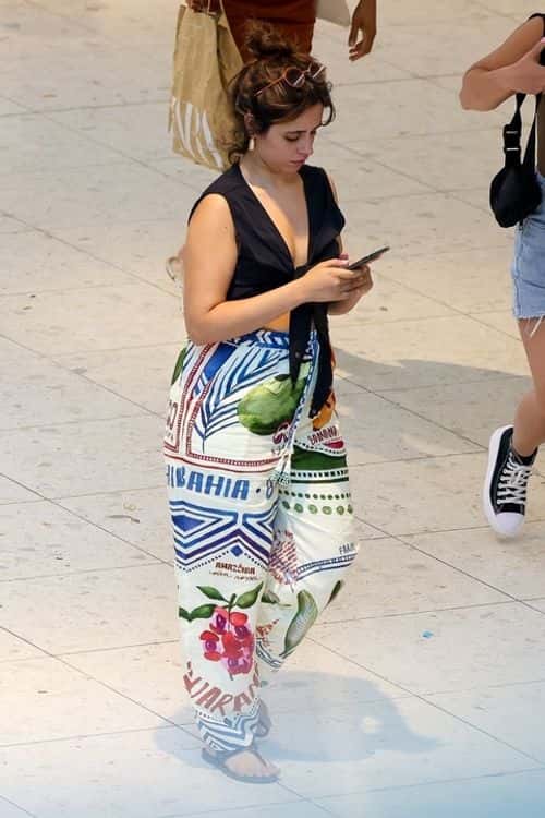 Camila Cabello wore a plunging black crop top with patterned pants at the mall in Miami on March 8 (Backgrid)