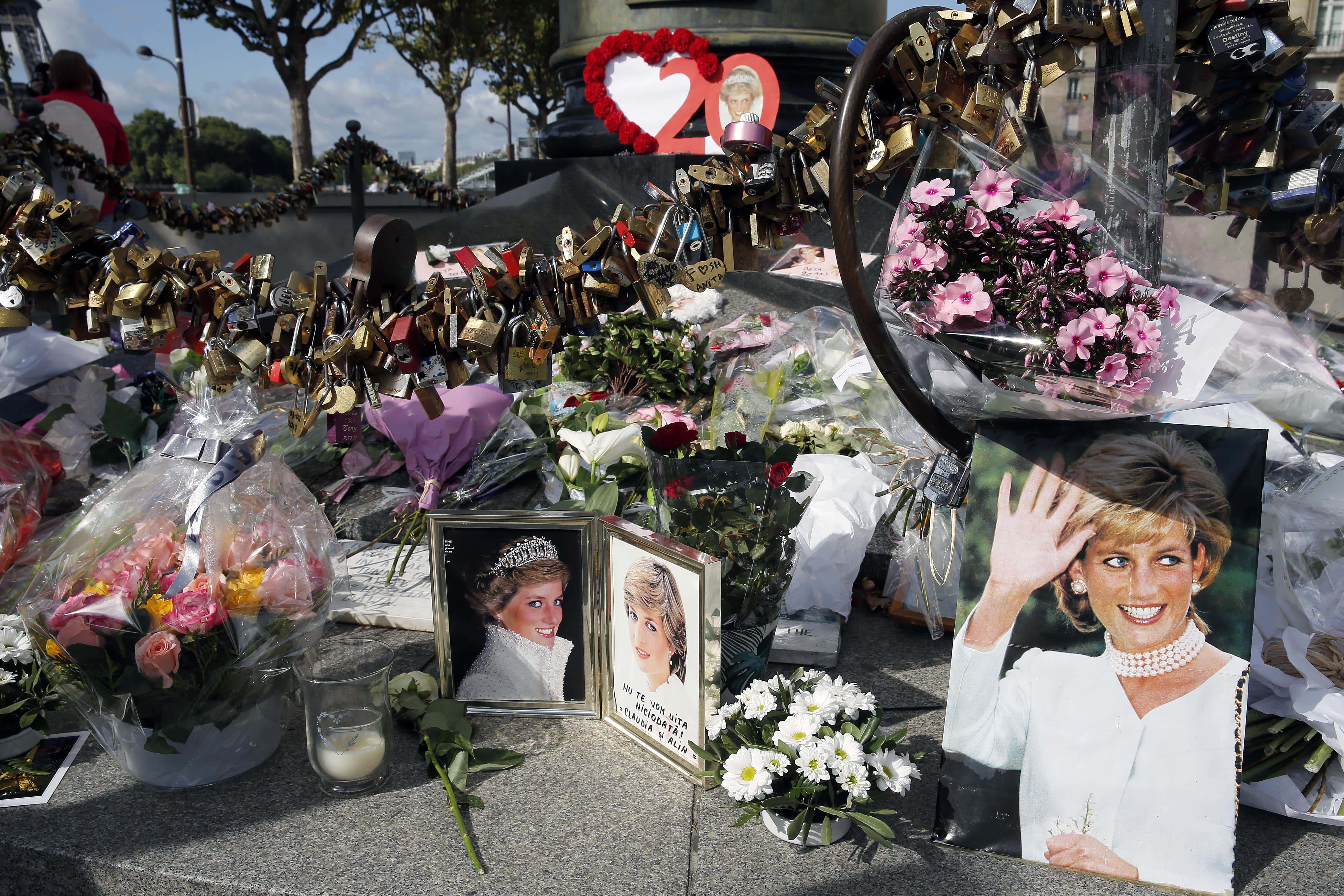 Iconic photos, flowers and messages dedicated to pay homage to Lady Diana to the 20th anniversary of her death adorn the plinth of the Flame of Liberty statue on August 31, 2017 in Paris, France. Princess Diana died in a car crash on August 31, 1997 near the Pont de l'Alma tunnel. The Flame of Liberty statue became the unofficial memorial to Diana, Princess of Wales.