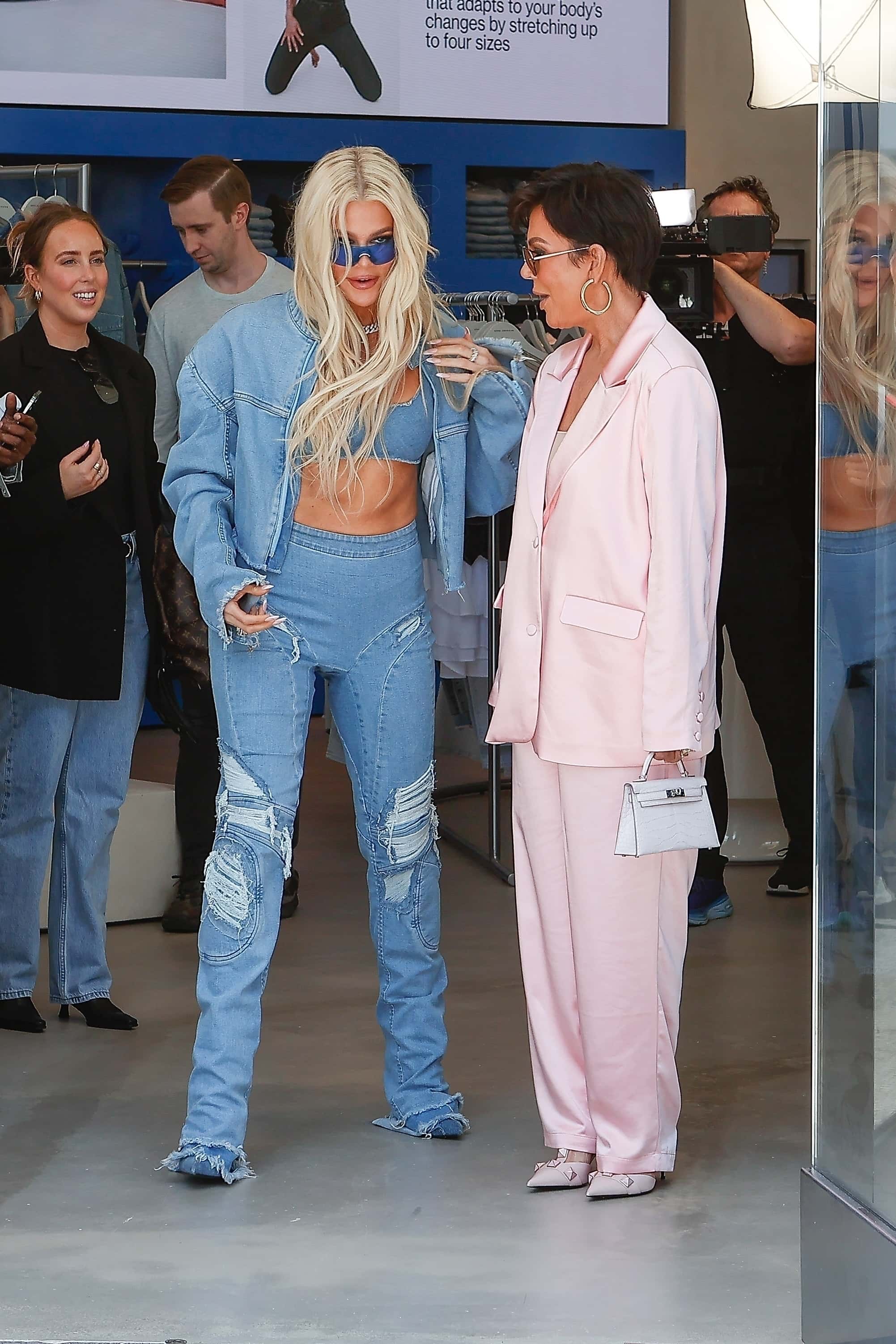 Chuckles ensued as the dynamic duo strolled out of the fresh boutique, brimming with joy (Backgrid)