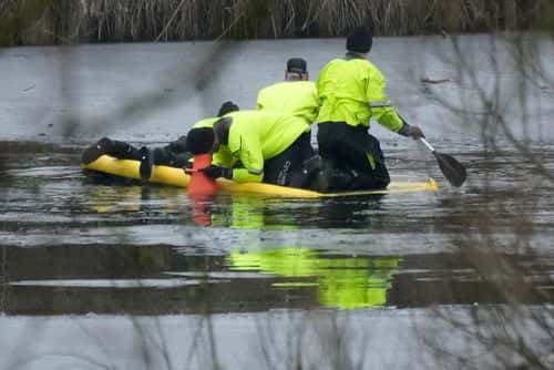 Emergency workers continue the search for further victims after a number of children fell through ice on a lake, on December 12, 2022 at Babbs Mill Park in Solihull, England. Three boys aged eight, 10 and 11 have died after falling through an icy lake last night. The search continued for more potential victims, following reports more children were present on the ice at the time of the incident.