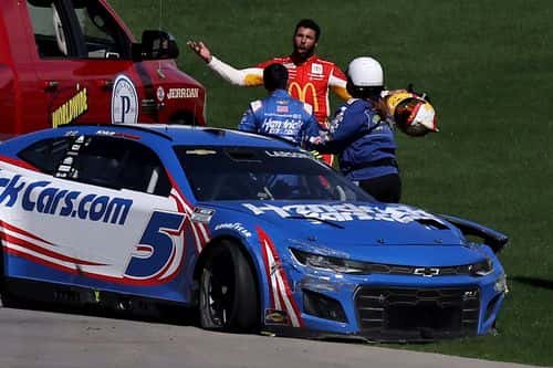 Bubba Wallace, driver of the #45 McDonald's Toyota, confronts Kyle Larson, driver of the #5 HendrickCars.com Chevrolet, after an on-track incident during the NASCAR Cup Series South Point 400 at Las Vegas Motor Speedway on October 16, 2022 in Las Vegas, Nevada.