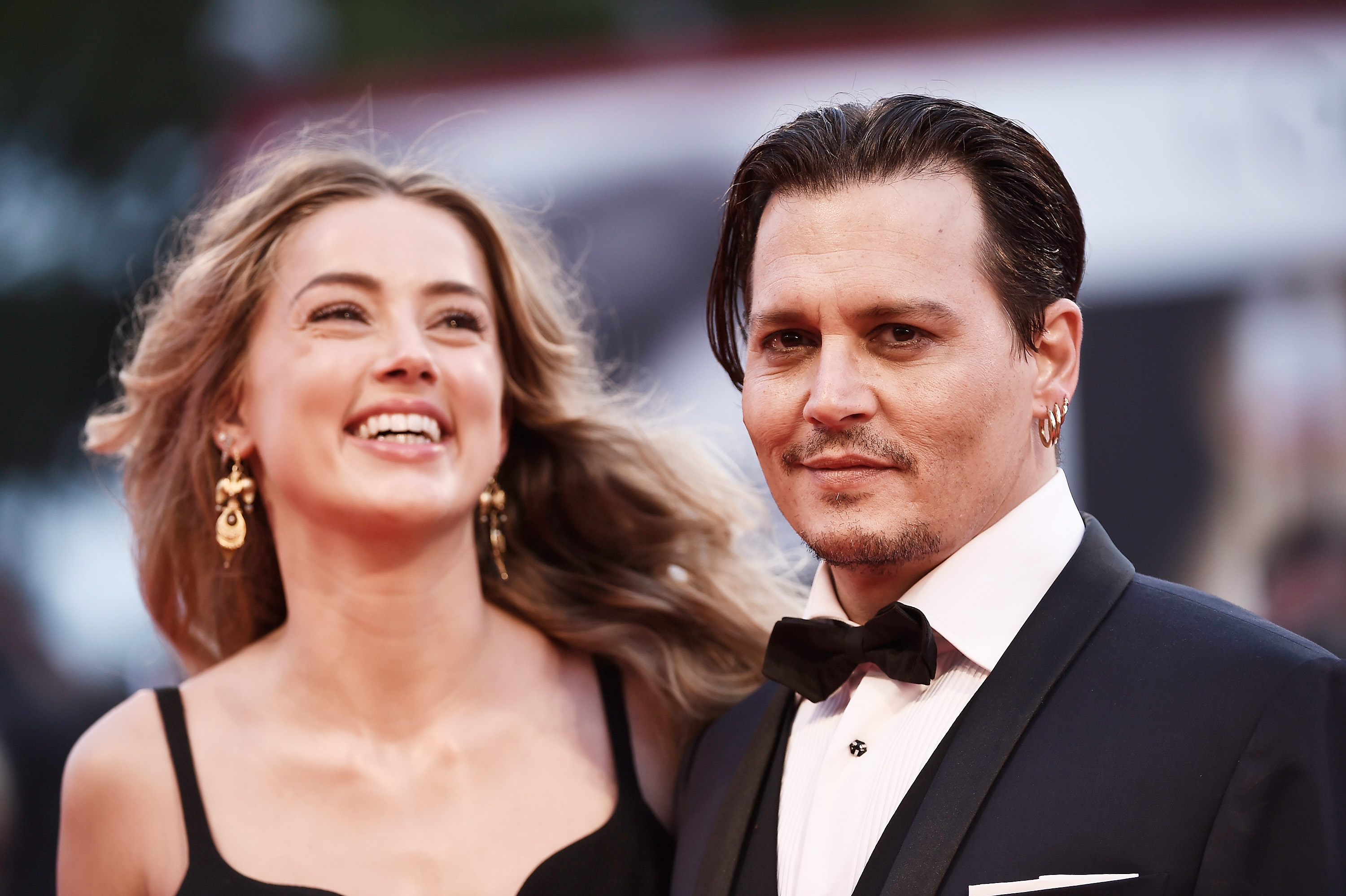 Johnny Depp and Amber Heard attend a premiere for 'Black Mass' during the 72nd Venice Film Festival at on September 4, 2015 in Venice, Italy.
