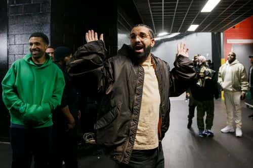 TORONTO, ON - APRIL 28:  Rapper Drake leaves Game Six of the Eastern Conference First Round between the Toronto Raptors and the Philadelphia 76ers at Scotiabank Arena on April 28, 2022 in Toronto, Canada. NOTE TO USER: User expressly acknowledges and agrees that, by downloading and or using this Photograph, user is consenting to the terms and conditions of the Getty Images License Agreement. (Photo by Cole Burston/Getty Images)