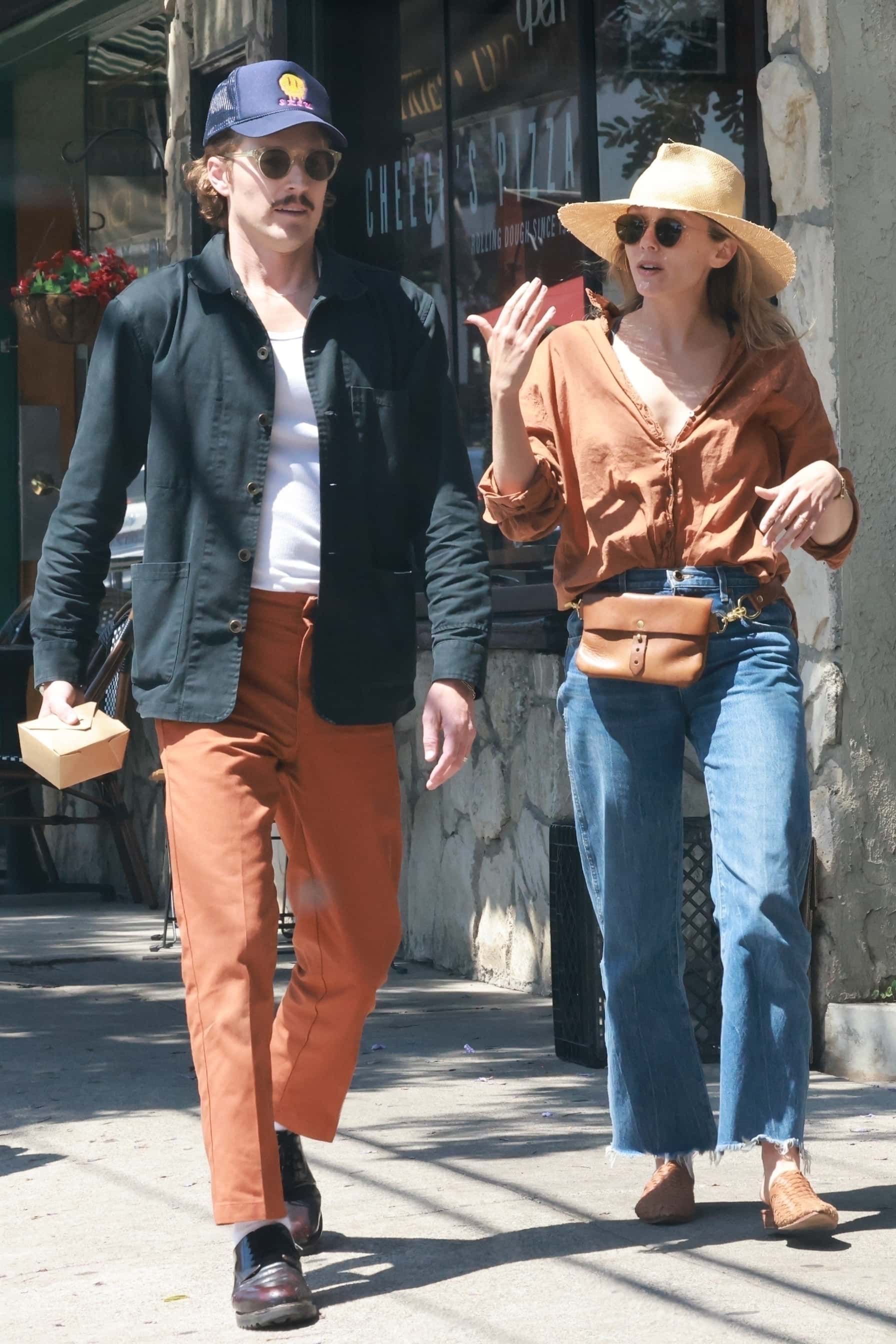 Elizabeth Olsen enjoys a casual lunch at Little Dom's in Los Feliz, chatting with a male friend (Backgrid)