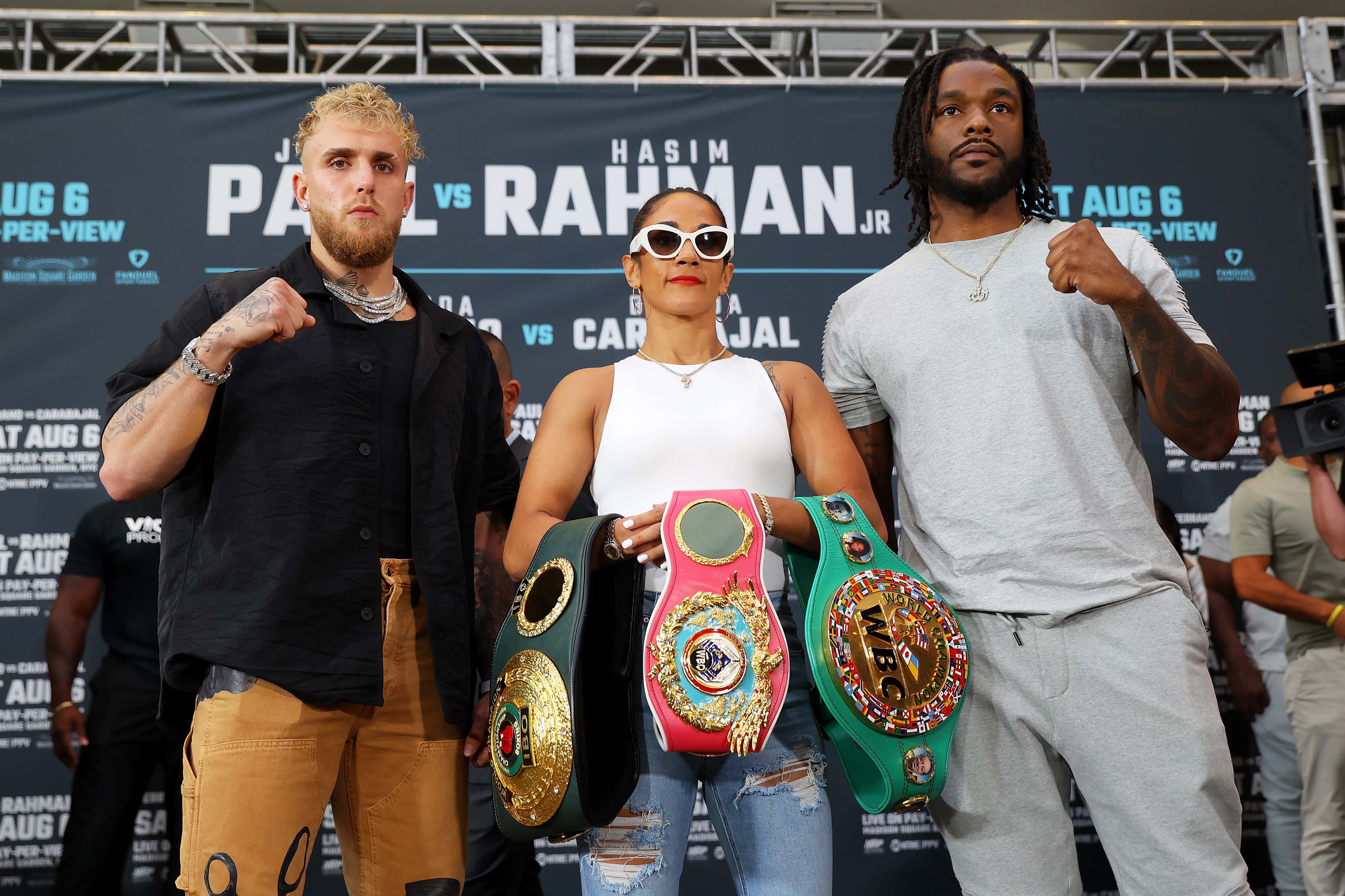 Jake Paul, Hasim Rahman and Amanda Serrano pose for a photo during a press conference at Madison Square Garden on July 12, 2022 in New York City.