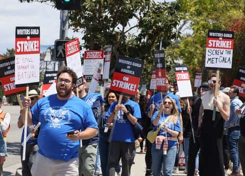 Members of the Writers Guild of America (WGA) and its supporters picket outside of Paramount Pictures on May 02, 2023 in Los Angeles, California. Hollywood writers have gone on strike in a dispute over payments for streaming services.