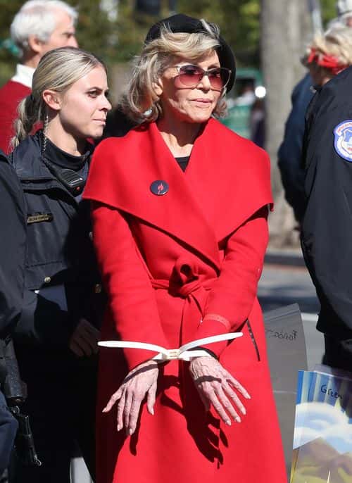 Actress Jane Fonda is arrested for blocking a street in front of the U.S. Capitol during a “Fire Drill Fridays” climate change protest and rally on Capitol Hill, October 18, 2019 in Washington, DC. Protesters are demanding urgent action on adapting the Green New Deal, clean, renewable energy, and an end to all new fossil fuel exploration and drilling.