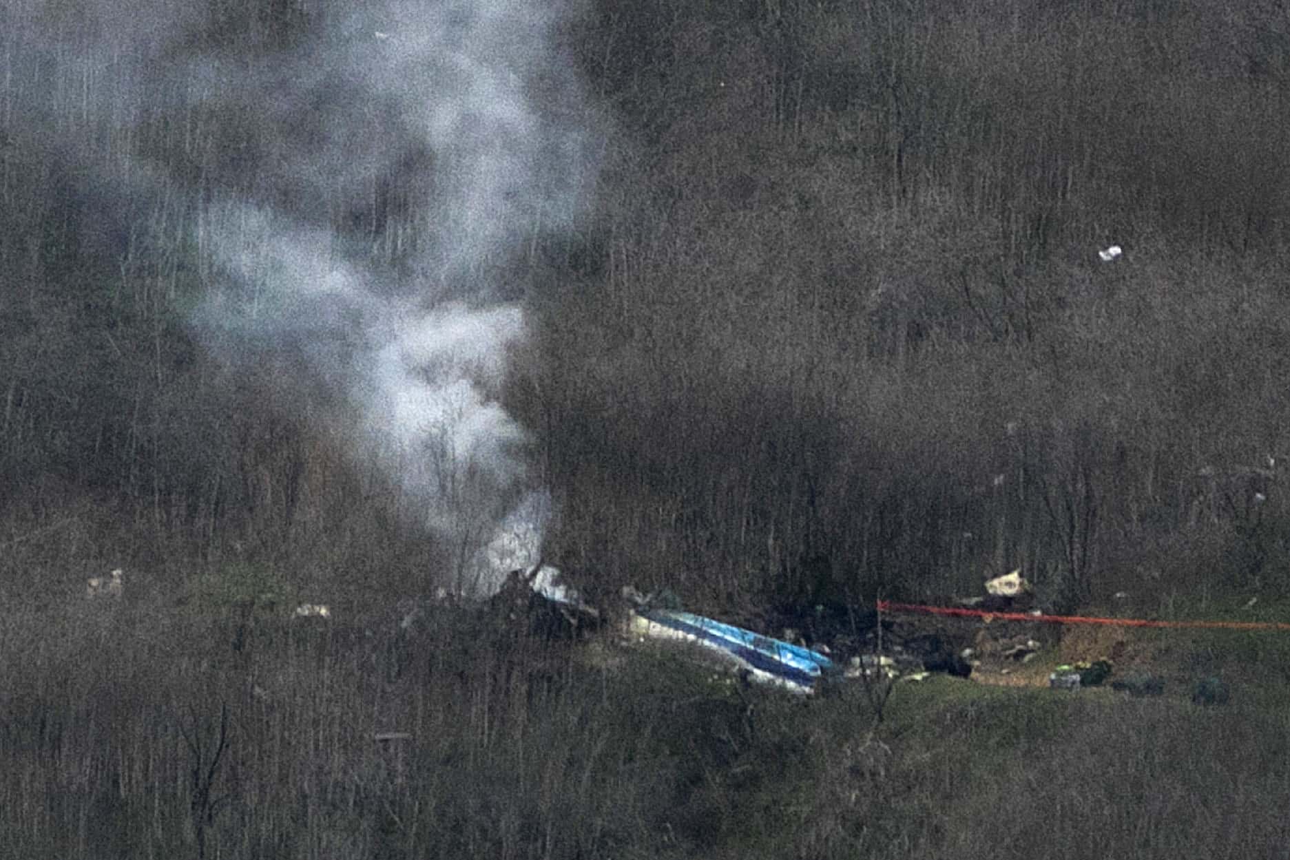 (EDITOR'S NOTE: Alternate crop.) Wreckage of the crashed helicopter that was carrying former NBA star Kobe Bryant and his 13-year-old daughter Gianna smolders on the ground on January 26, 2020 in Calabasas, California. According to reports, five people including Bryant and his daughter have been confirmed killed in the crash.
