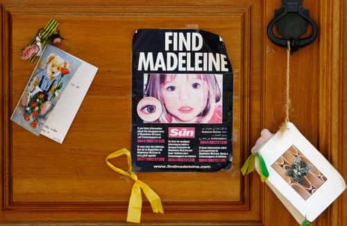 A poster and cards are placed on the Church door in Praia da Luz for missing Madeleine McCann August 9, 2007 in Praia da Luz, Portugal. Police continue there investigation in the Algarve village after blood was found in the McCann Apartment.