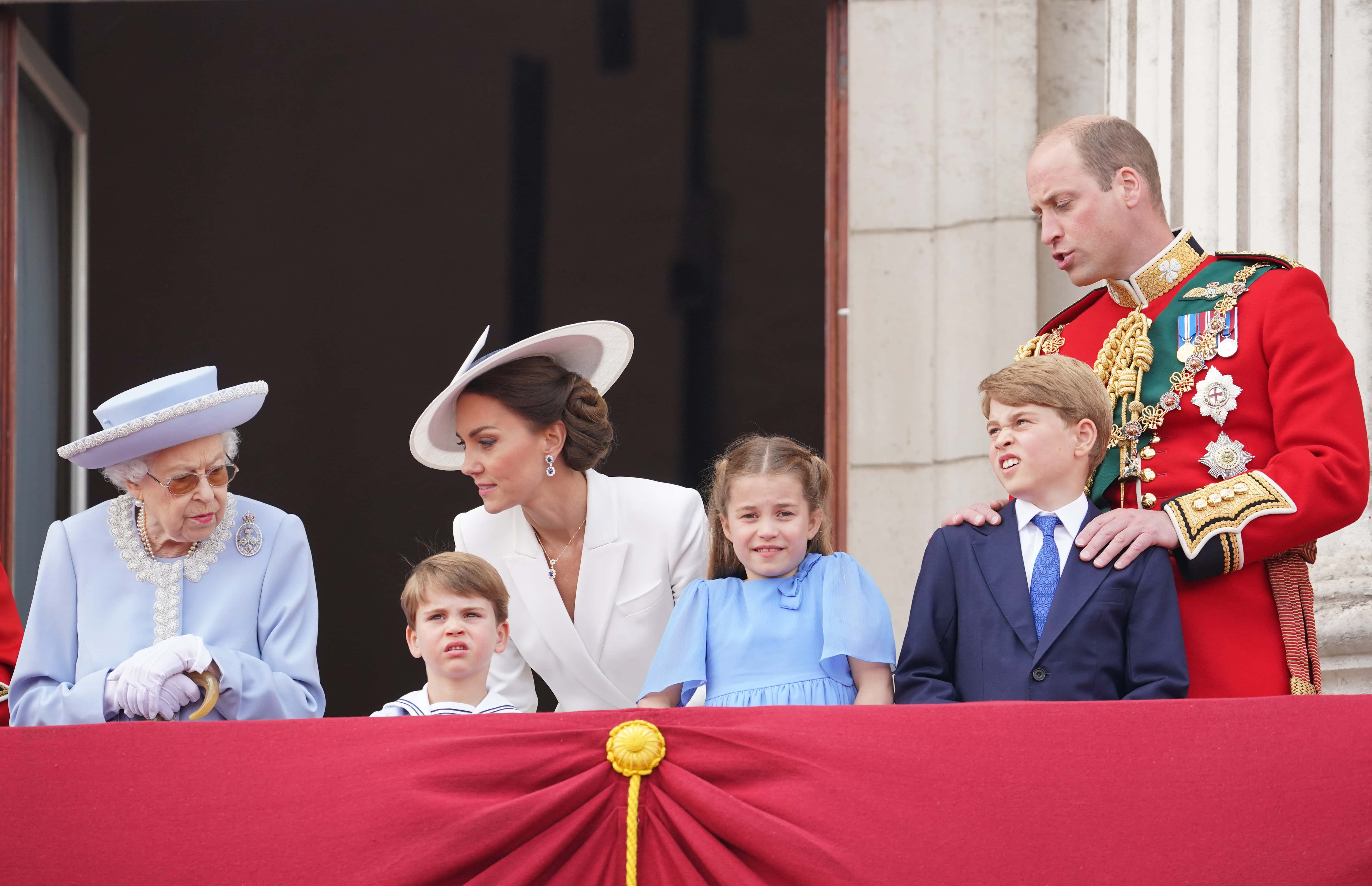 (L-R) Queen Elizabeth II, Prince Louis of Cambridge, Catherine, Duchess of Cambridge, Princess Charlotte of Cambridge, Prince George of Cambridge and Prince William, Duke of Cambridge on the balcony of Buckingham Palace watch the RAF flypast during the Trooping the Colour parade on June 02, 2022 in London, England. The Platinum Jubilee of Elizabeth II is being celebrated from June 2 to June 5, 2022, in the UK and Commonwealth to mark the 70th anniversary of the accession of Queen Elizabeth II on 6 February 1952.